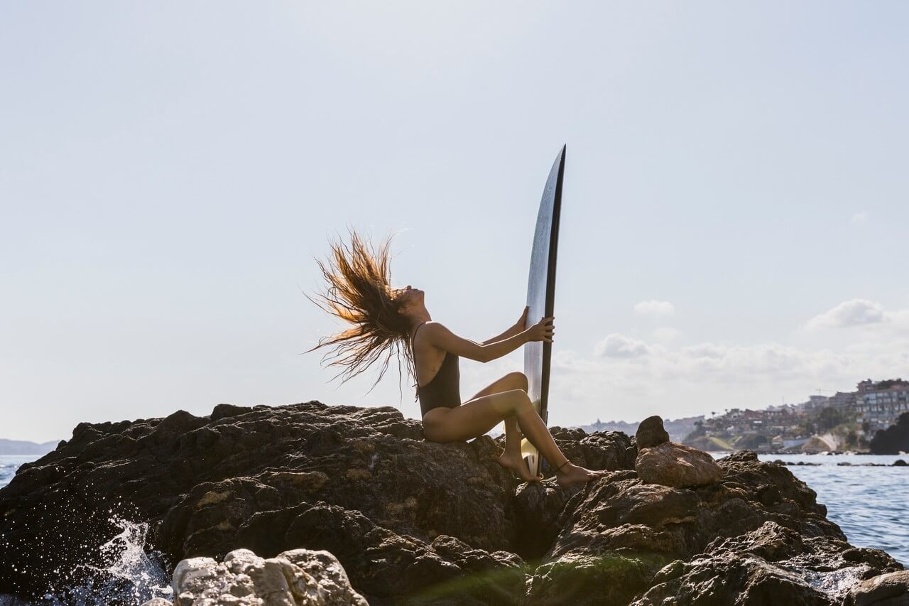 Woman-with-surfboard-bali-beach